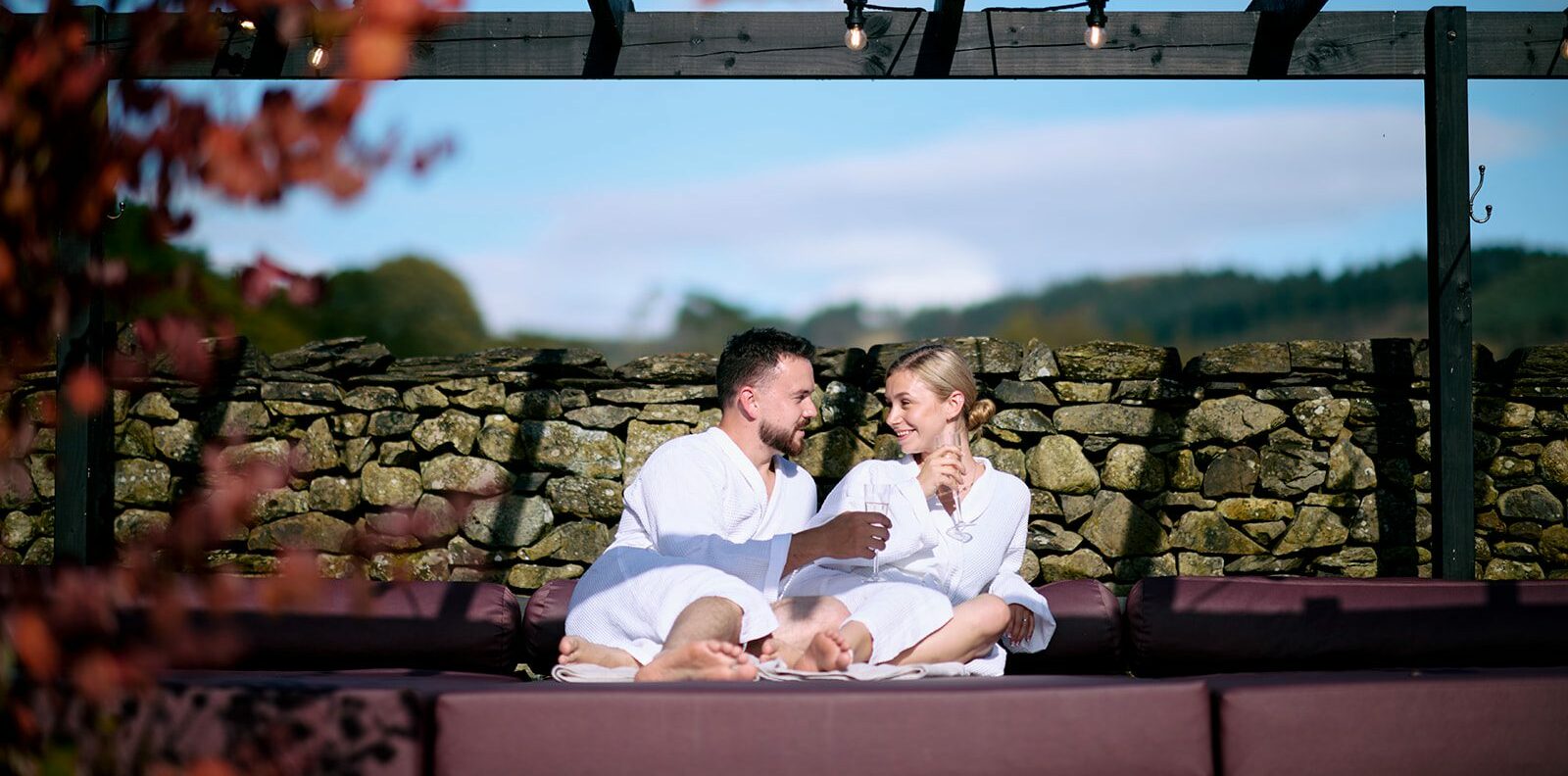 a-couple-sat-in-the-spa-garden