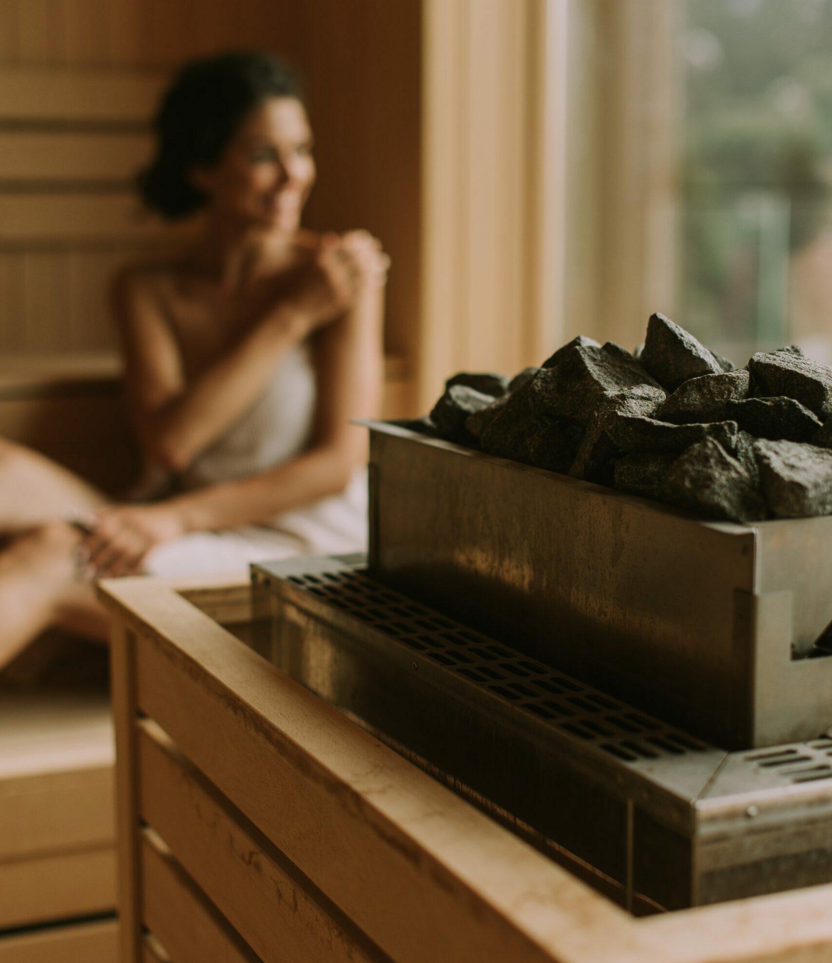 woman relaxing in sauna